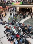 Extinction Rebellion Youth stage die-in at Manchester Arndale